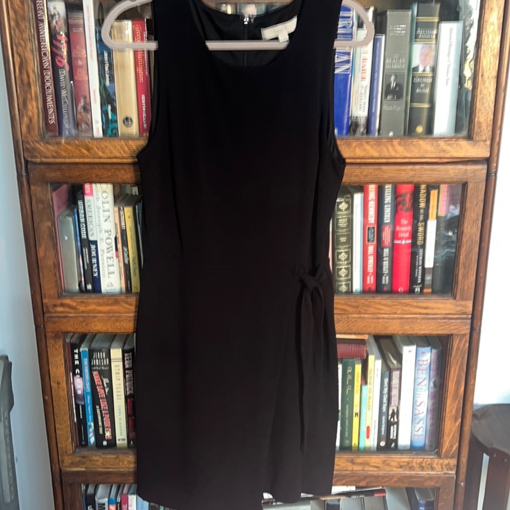 Sleeveless black wrap waist dress,
